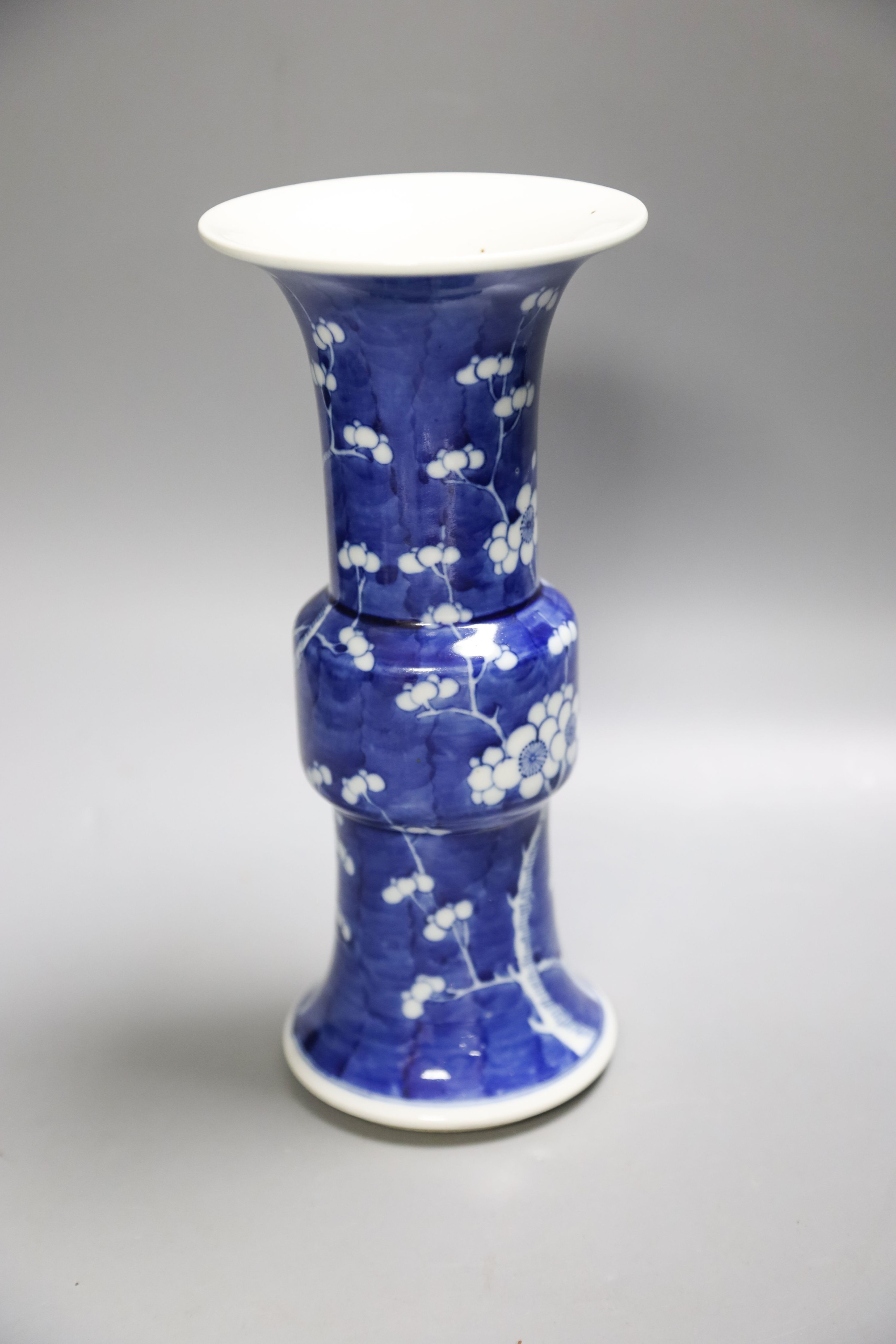 A Chinese blue and white prunus decorated gu vase, 26.5cm